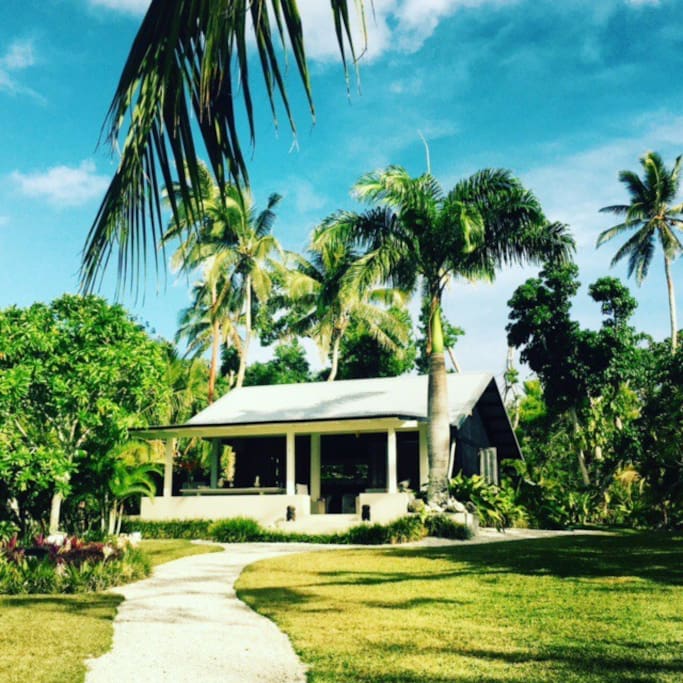 The Boat House rests among the coconut trees in manicured gardens