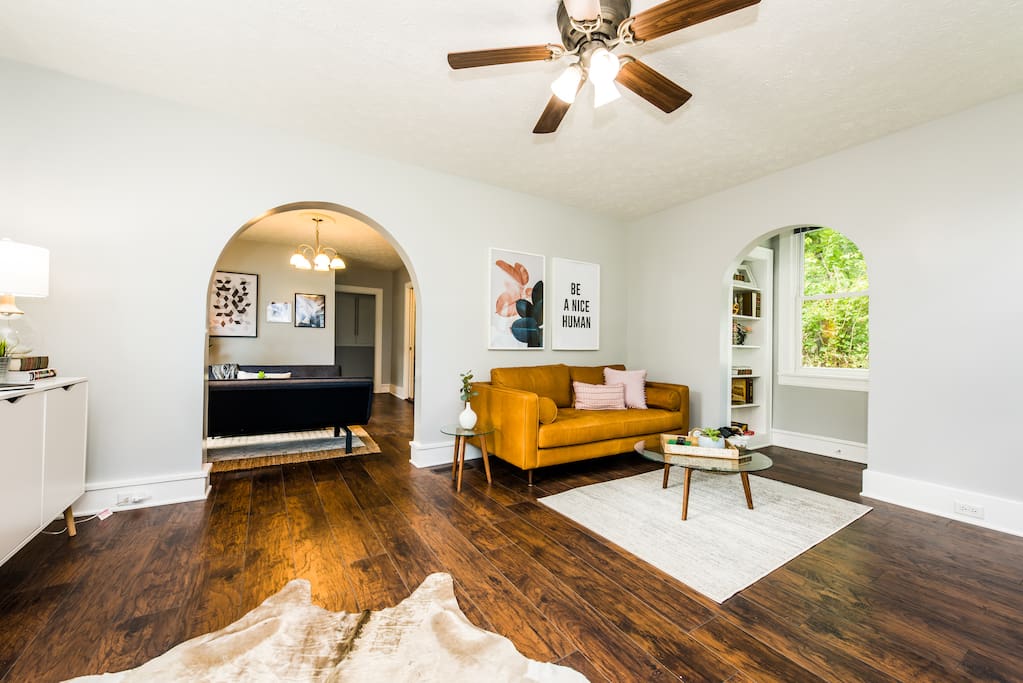 Bright living room with lots of windows.