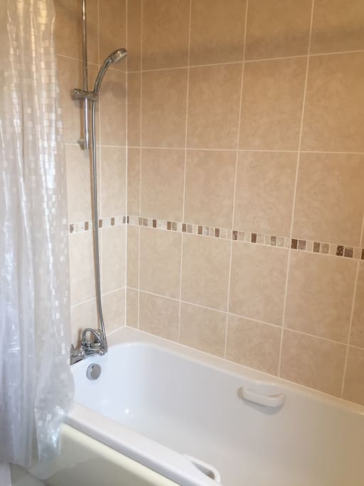 Clean, modern bathroom with shower. Bathroom for guests only. We use our own bathroom.