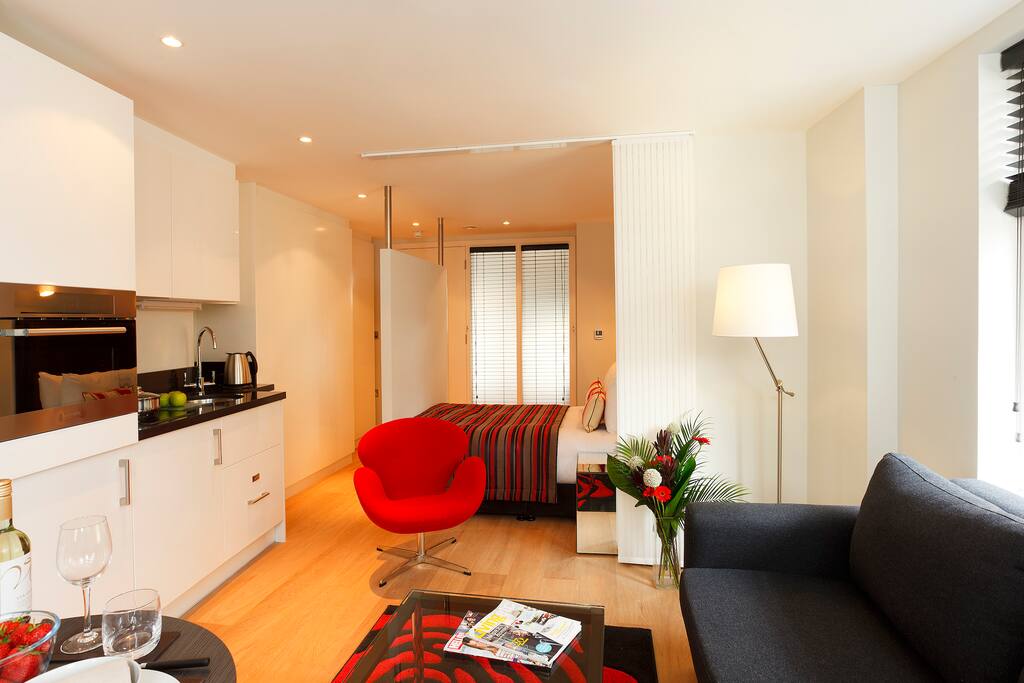 Comfortable Living-room with flat-screen TV and a work/dining table