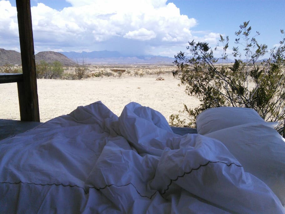 Sleeping inside or outside, there is always a beautiful view, to wake up to. Grab some pillows and a blanket from the linen closet and you're ready for an adult camping experience~ replete with pallet bed on rollers.