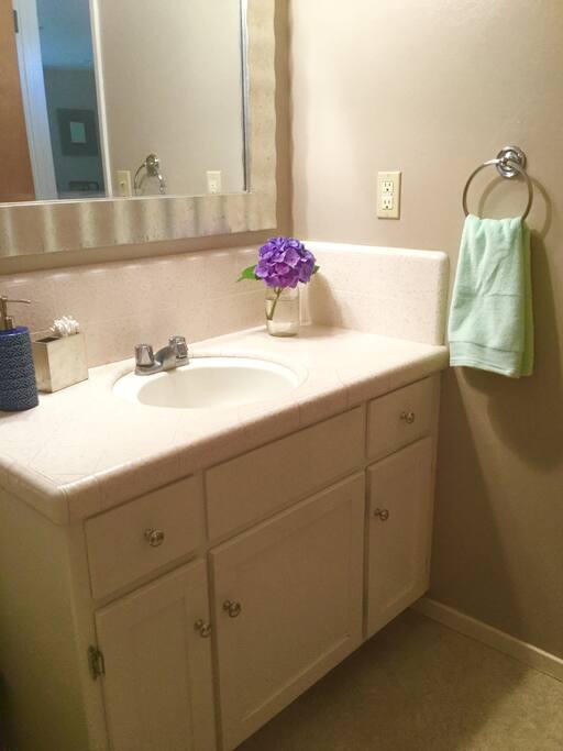 A blow dryer is available and located in the bathroom vanity.