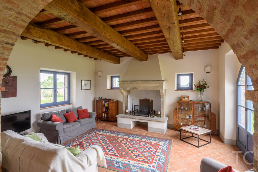 Large and cosy sitting room with access to terrace and gardens, fireplace, large TV