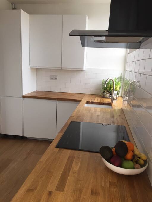 Modern, clean kitchen with necessary mod-cons including a Nespresso coffee machine
