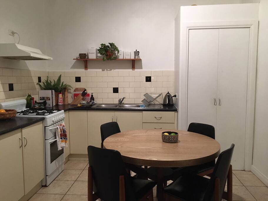 This is the kitchen, with a gas stove/oven. Dining table seats 4.