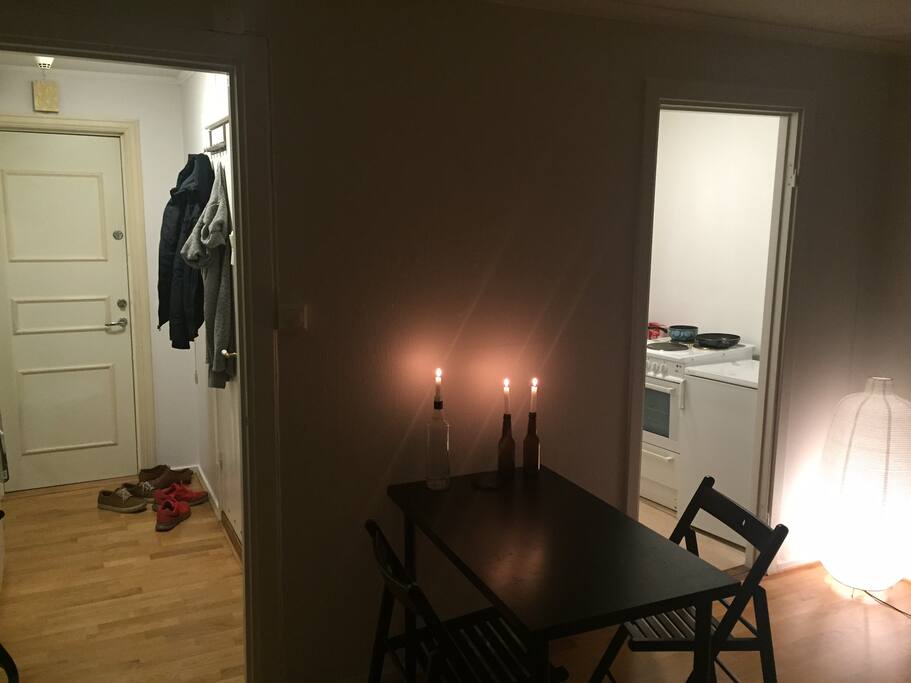 Hallway and toilet to the left. Kitchen and washing mashine to the right.