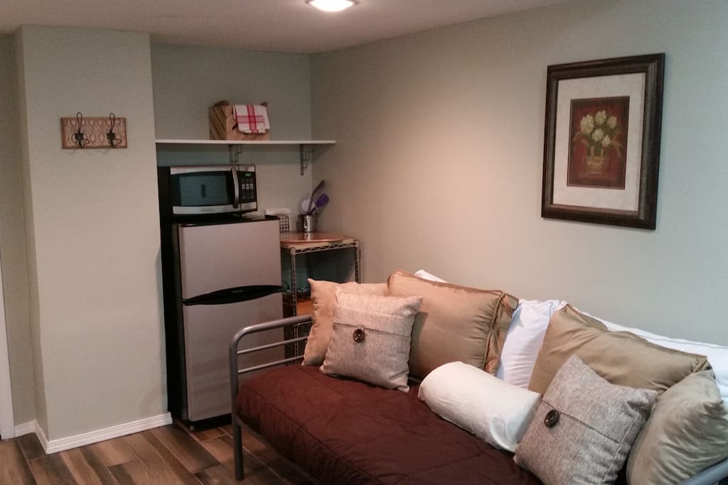 Small executive style kitchenette with fridge, microwave, 3 in 1 toaster/hot plate/coffee machine.