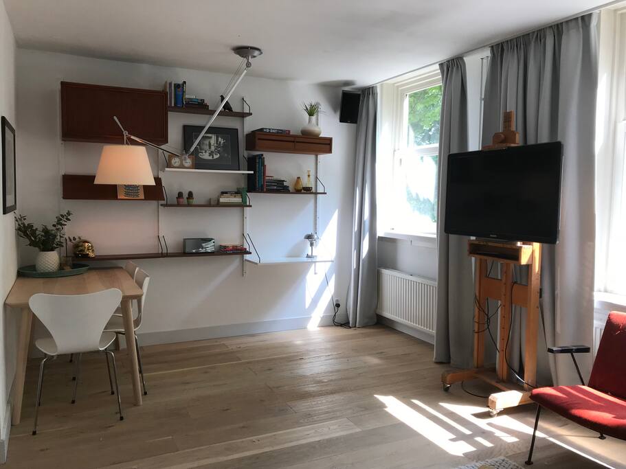 Mobile Tv unit with chromecast (streaming) and cable. Adjustable dinner table lamp for rearranging the dining table.