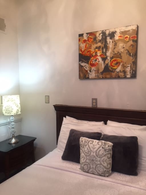This cozy room is ideal for backpackers, or travelers that need an affordable place to stay. There is a table and chairs not pictured.
