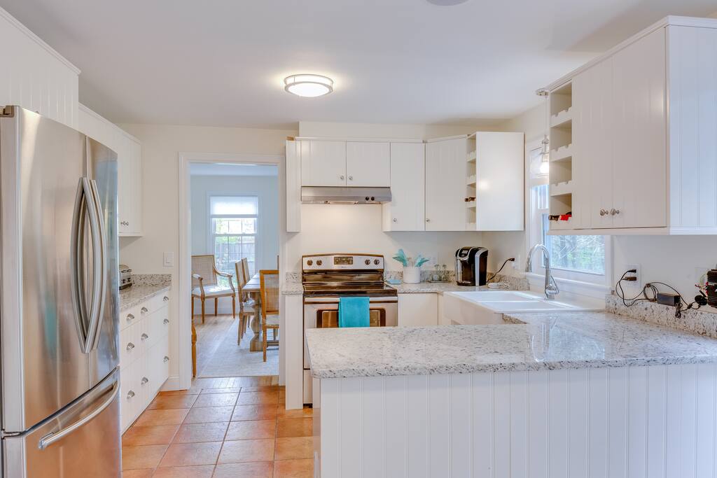 New kitchen with granite countertop and stainless steel appliances