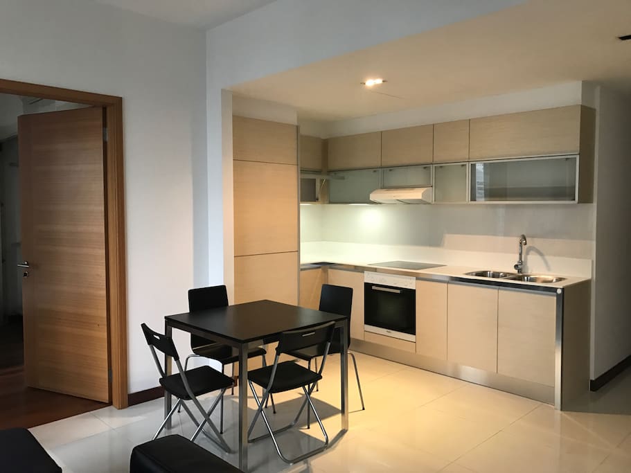Open kitchenette with oven , dining area