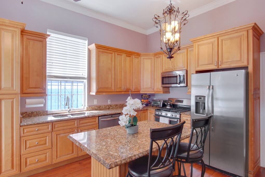 Gourmet kitchen features everything you might need to prepare and serve a meal. Seating for 6 plus another folding table and folding chairs.