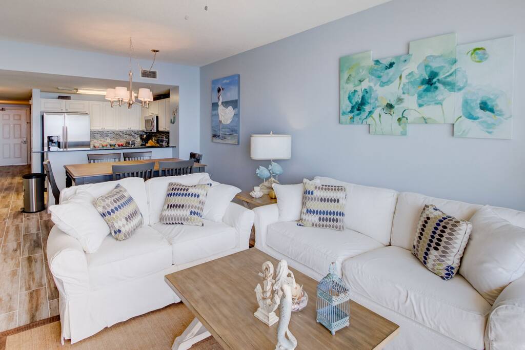Living area features plush seating and exudes modern elegance