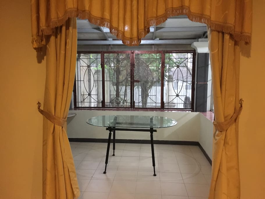 Unique semi indoor back terrace to enjoy morning coffee or tea looking at trees, grasses. When raining you can see the rain grains just next to you and feel the coolness.. really peaceful.