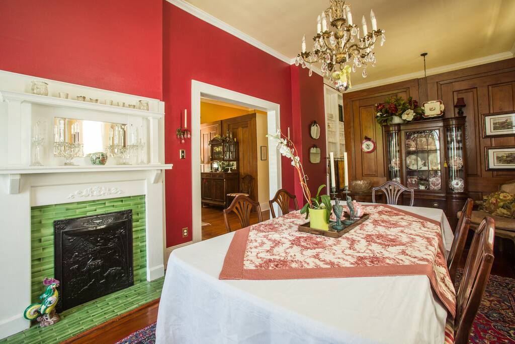 The archway to the right of the fireplace in the dining room is the owner's side of this traditional double.