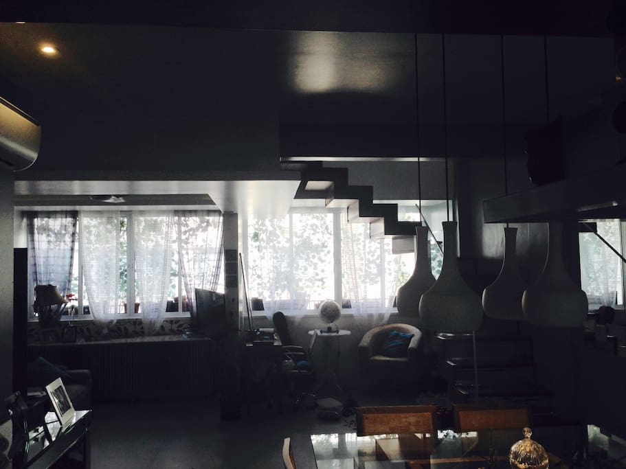 Kitchen view. Our family space. A space for dining, watching TV, play with kids, relax and read before sleep! On the right side, the stair that takes to the Second flor.