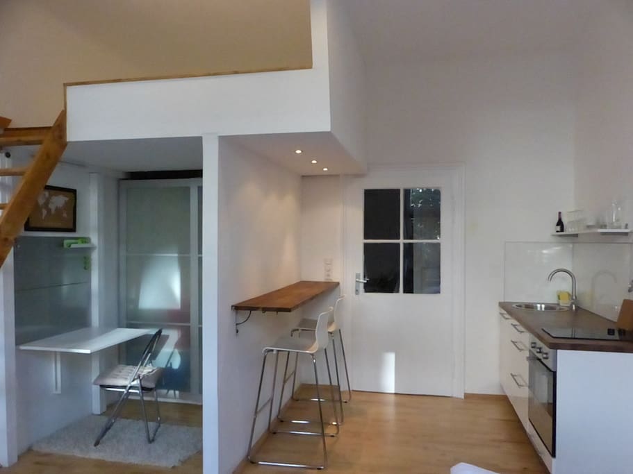 Office-corner under the gallery. Small kitchen on the right.