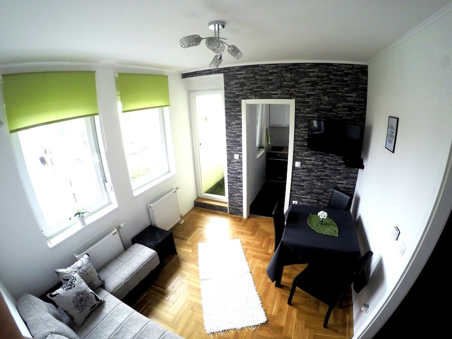 Bright and sunny living room with dinning area