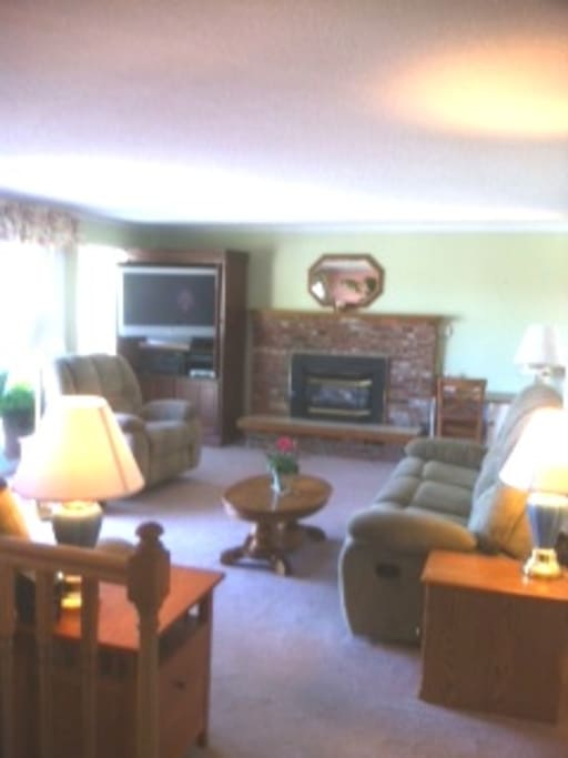 Living room with gas fireplace & large screen TV