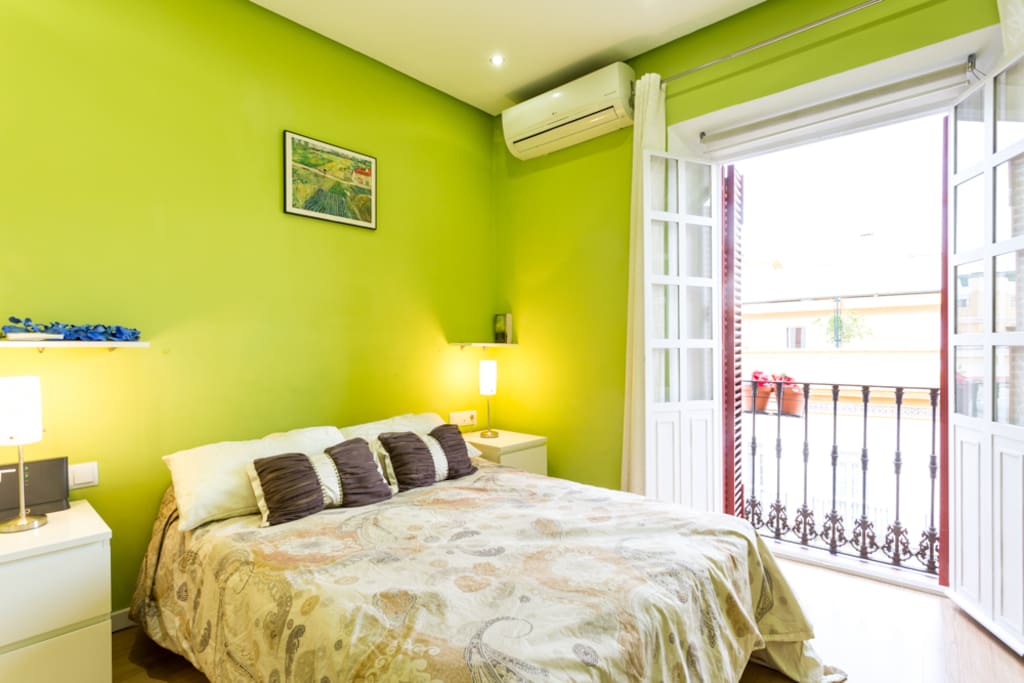 Comfortable bed and balcony with wonderful views.