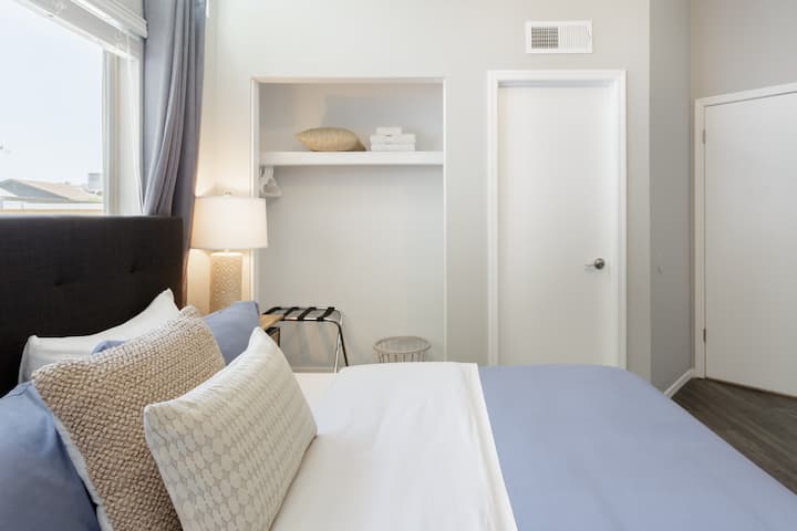 Primary suite with a king size bed with smart television