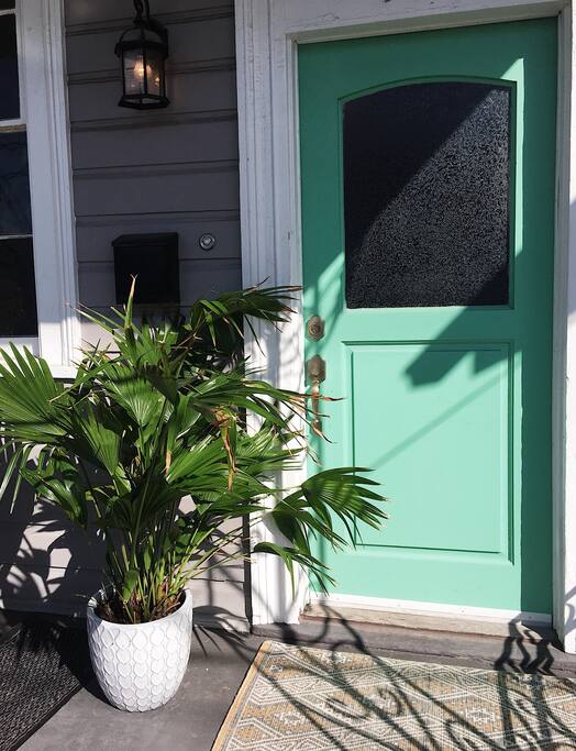 Front porch with greenery and chairs