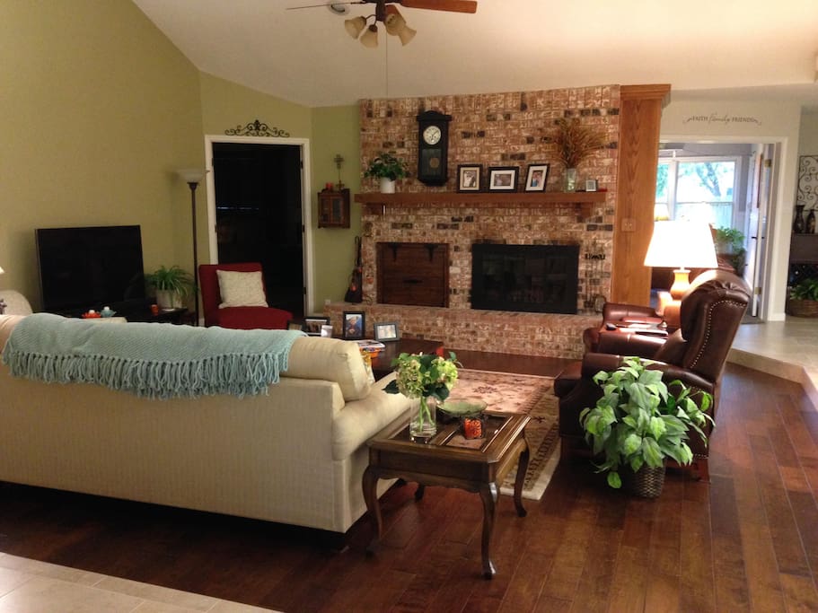 Living room complete with cozy blankets, recliners, and TV with blu-ray and DVD player. Perfect for resting after a long day playing around town.