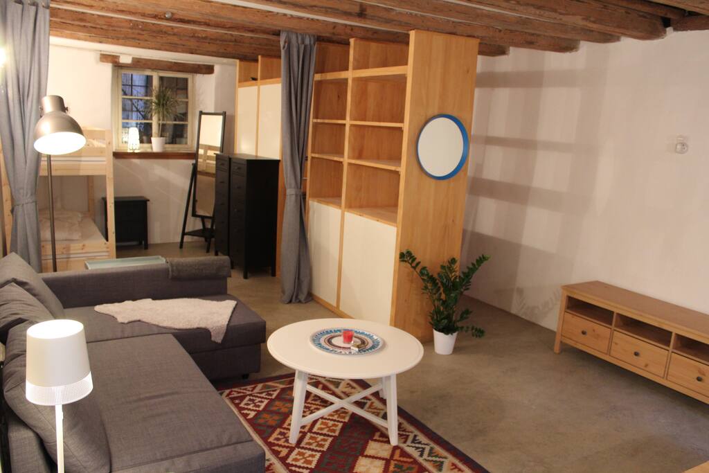 Living area with bedroom in the background