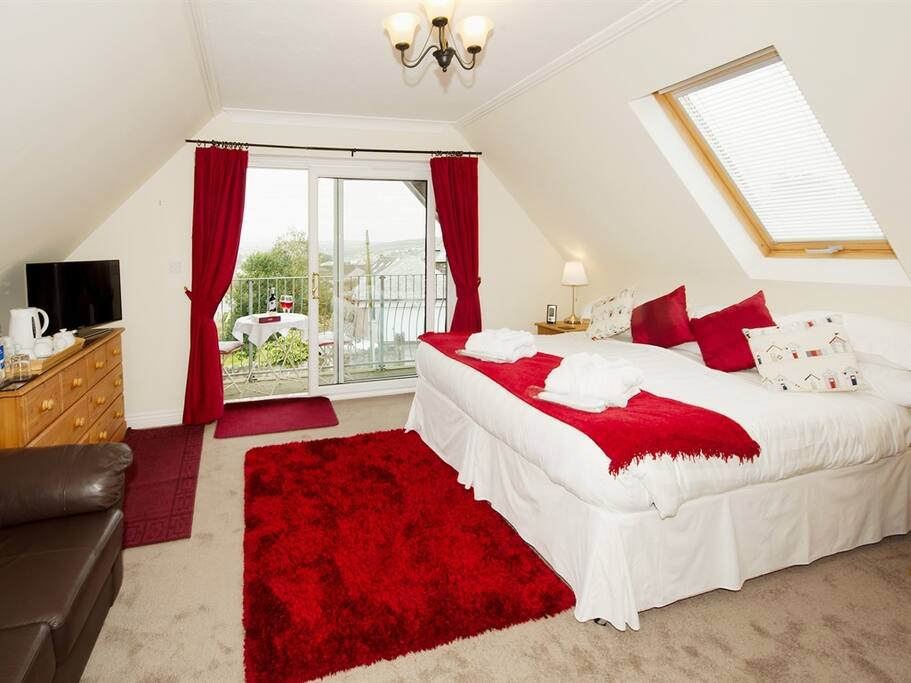 Polzeath room shown with super king double bed. Polzeath room has a balcony with views across Wadebridge