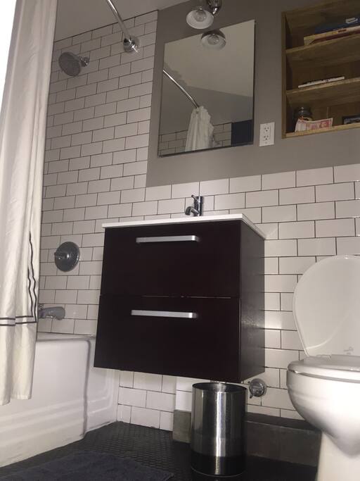 Modern, chic bath room. Plenty of hot water. You'll get your NYC day started wonderfully.