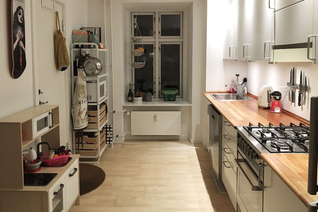 Fully functional kitchen with gas stove, microwave oven and even a play kitchen