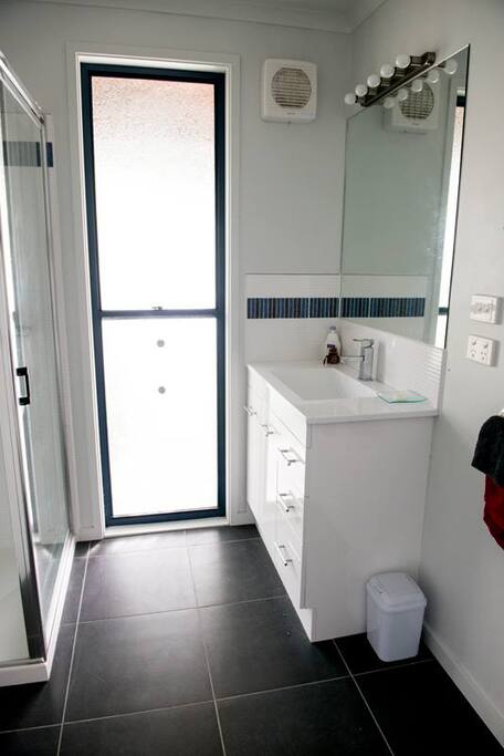 Full ensuite with shower over the bath.