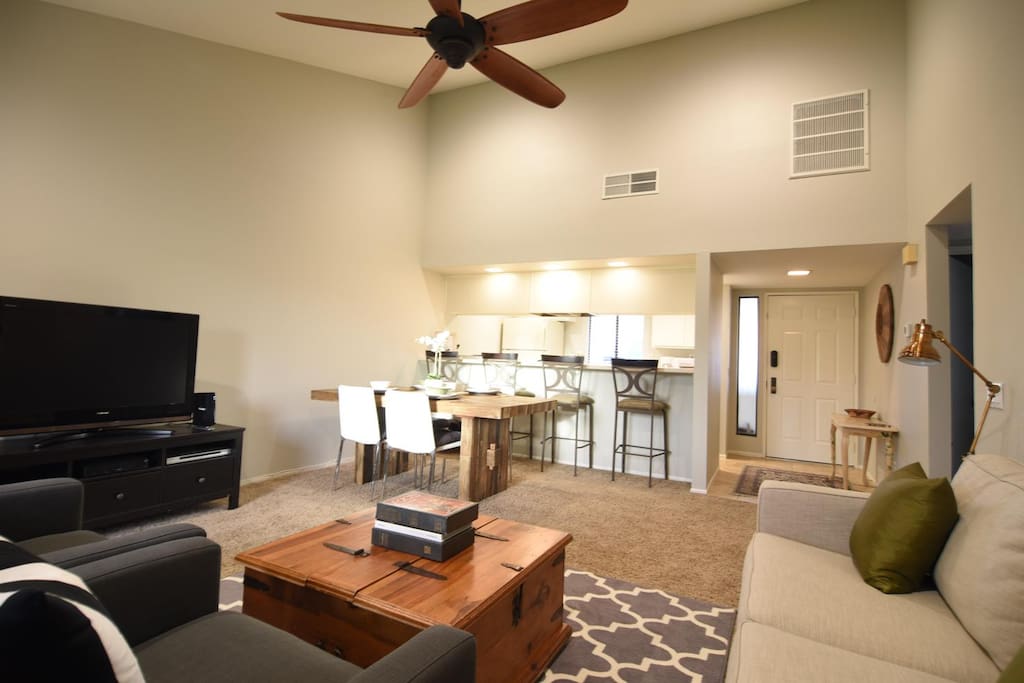 Larger wooden paddled ceiling fan and queen sleeper sofa.