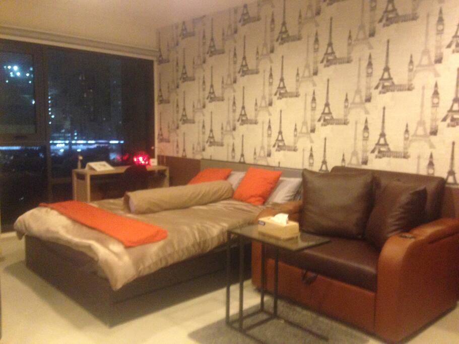 A queen bed and a sofa bed