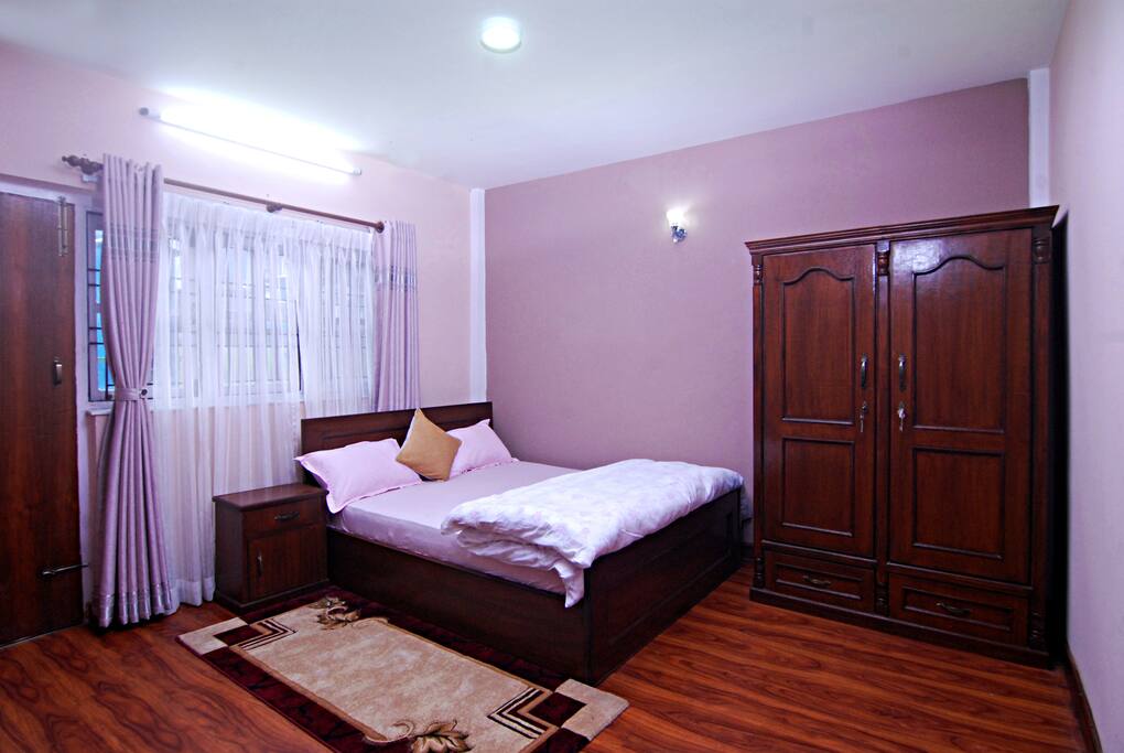 King size bed room in Khushi Homestay