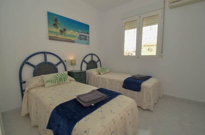 All the beds and mattresses in the apartment  are new, the pillows and mattresses have hygienic toppers. The is air conditioning in here with a very large wardrobe with hangers and hanging shelves. A TV is new to this room, please bring a fire stick 