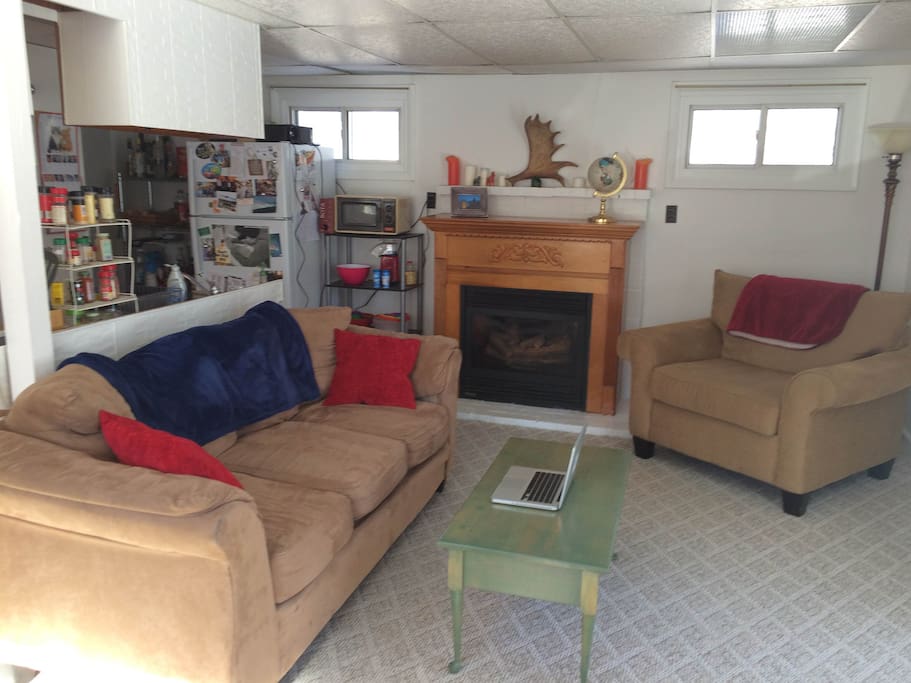 Projector, couch, chair, table, gas fireplace, popcorn station