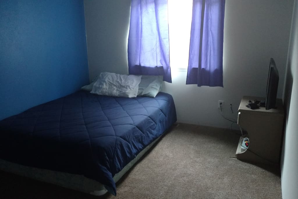 Guest room with a queen bed.