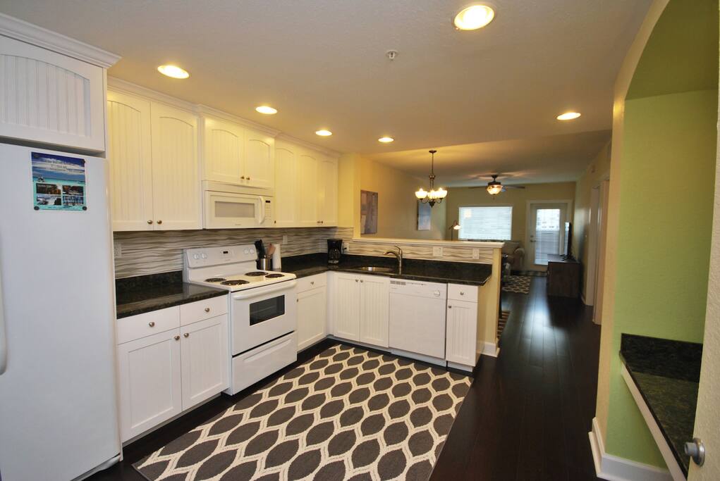 Kitchen - Fully equipped with plates, pots, pans, silverware, coffee maker and more.