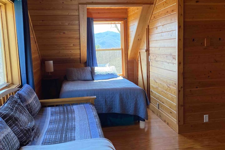 Part of the loft! Seen here is a comfortable queen-size bed and a daybed with a popup trundle!