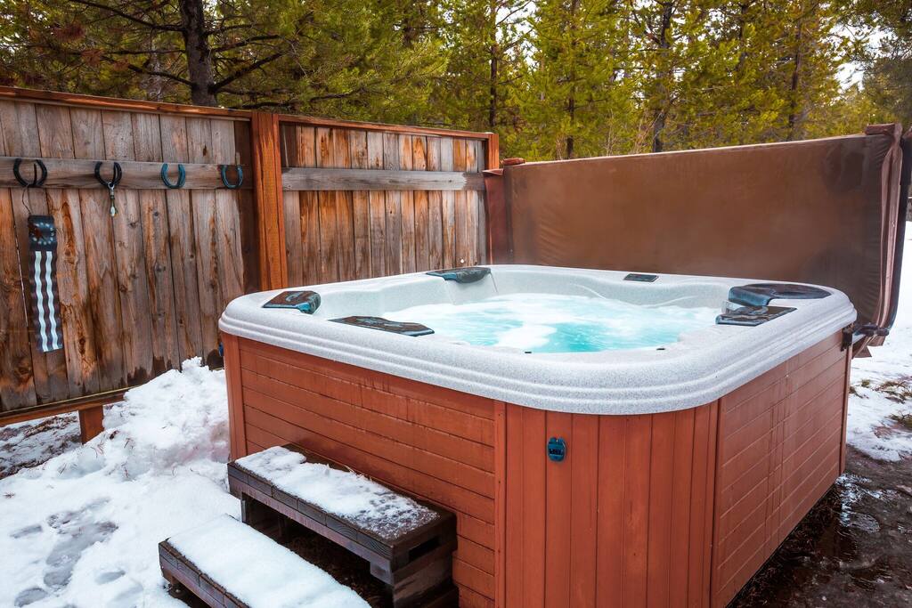 Enjoy the privacy of our hot tub under the stars surrounded by trees and are cedar fence. The hot tub is approximately 60 feet from the back slider.