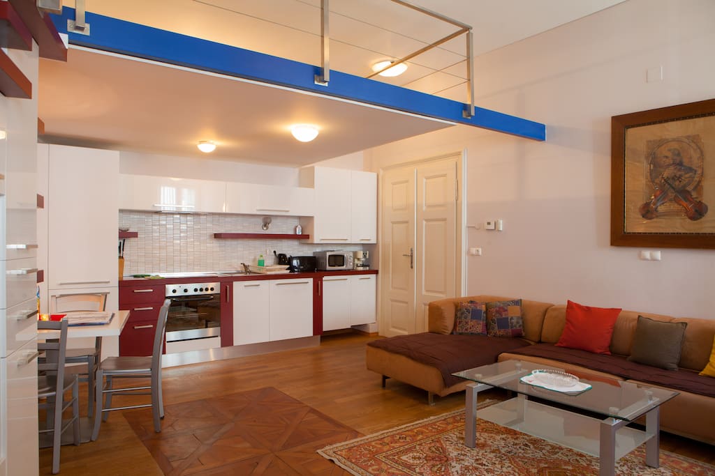 Kitchen and living room with dining table