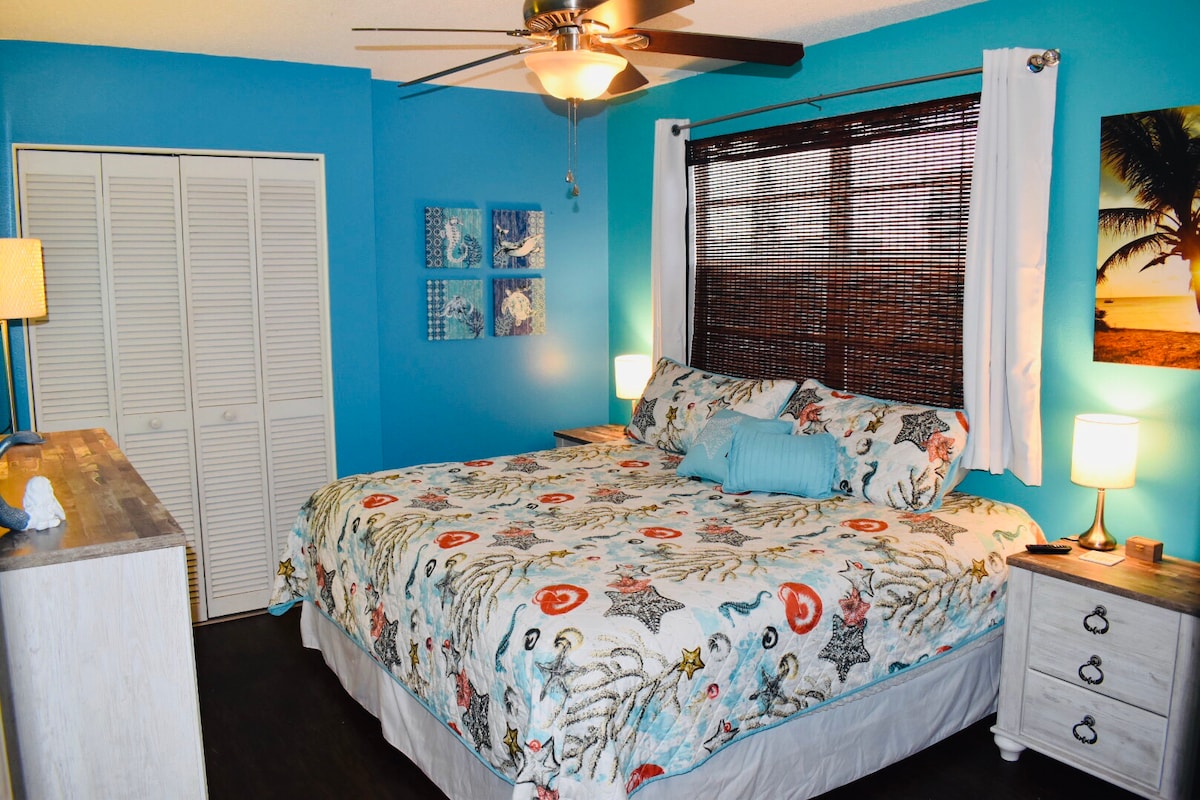 Bedroom 2 in Unit #2 with King size bed, blackout curtains and smart TV