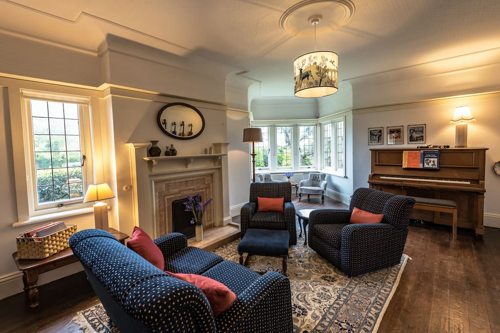 The music room has a piano, guitars and ukeleles plus a TV with Netflix and an open fire