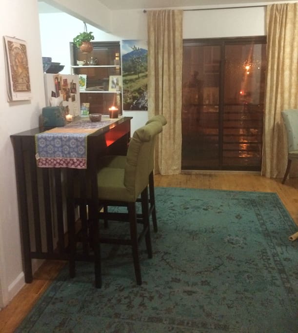 Open living space with High-top table and comfy bar chairs