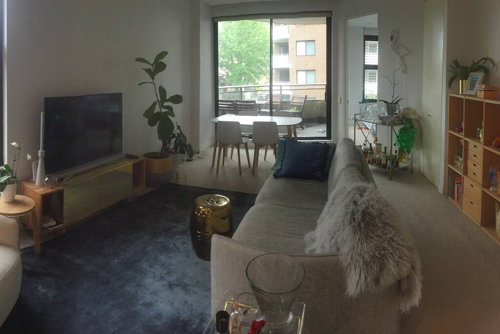 Open plan living and dining room with attached balcony