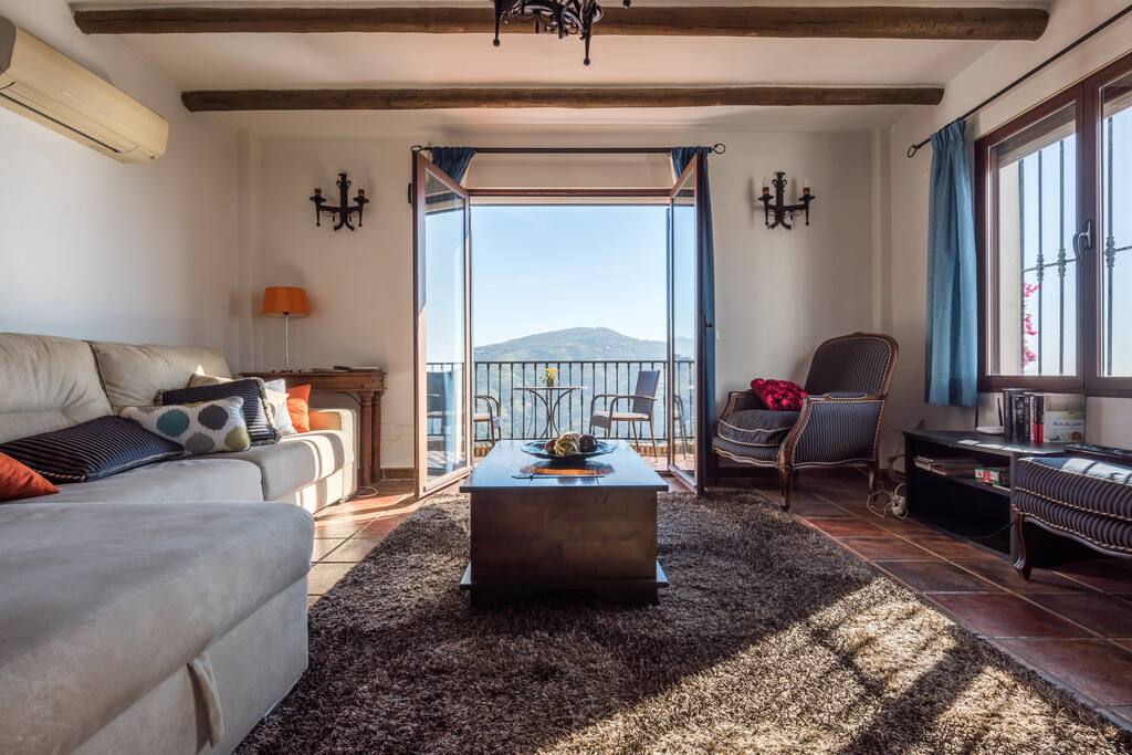 TV corner with fire place and direct access to balcony