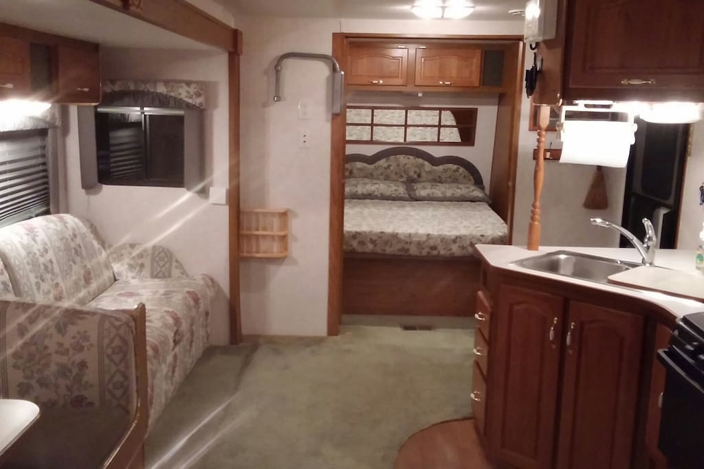 Living area with master bedroom far.