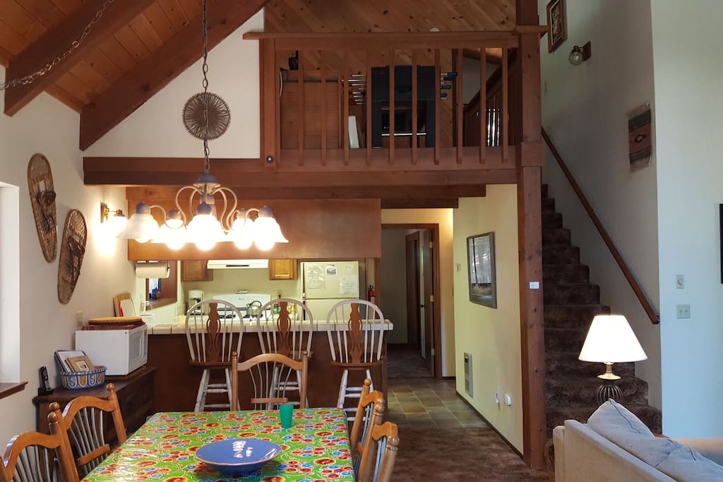 Fully stocked kitchen and plenty of seating in the dining room and at the kitchen bar