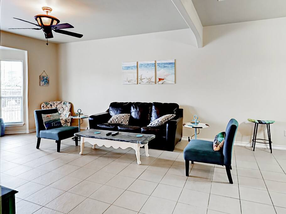 Sit back and watch the 50" wall-mounted TV in the welcoming living room. Complimentary Wi-Fi provided.